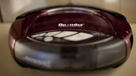 A vacuuming Roomba model robot is displayed at iRobot headquarters in Bedford, Massachusetts,  