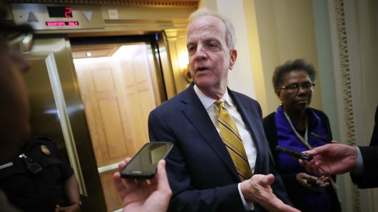 Sen. Jerry Moran (R-KS) (C) talks with reporters before stepping into the weekly Republican policy luncheon at the U.S. Capitol April 17, 2018 in Washington, DC. Vice President Mike Pence joined the GOP senators for their meeting. 