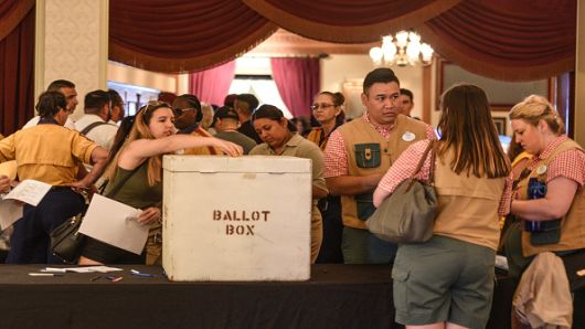 Disneyland Resort employees cast their ballots during voting on a new union contract at the Main Street Opera House in Disneyland in Anaheim, CA