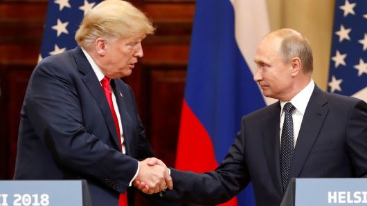 President Donald Trump and Russian President Vladimir Putin shake hands as they hold a joint news conference after their meeting in Helsinki, Finland July 16, 2018.