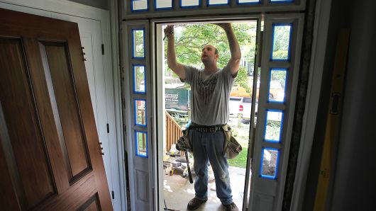 A home improvement contractor works on a house in Cambridge, Massachusetts.