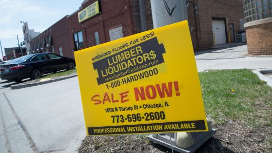 A sign advertising a sale sits outside a Lumber Liquidators store on April 29, 2015 in Chicago, Illinois.