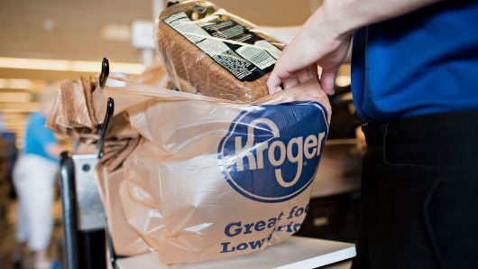 An employee bags a customer's purchases at a Kroger store in Peoria, Illinois.