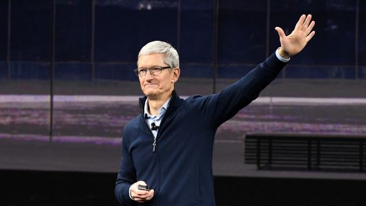 Tim Cook, chief executive officer of Apple Inc., waves after speaking during an event at the Steve Jobs Theater in Cupertino, California, U.S., on Tuesday, Sept. 12, 2017.