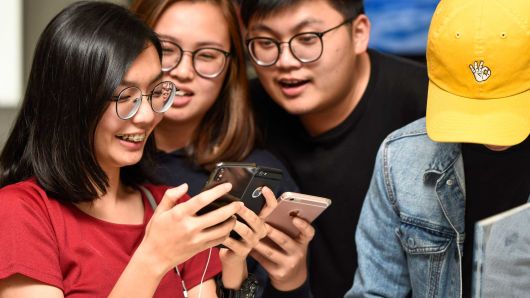 Excited newly-released iPhone X customers in Kuala Lumpur, Malaysia.