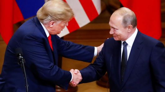 President Donald Trump and Russian President Vladimir Putin shake hands as they hold a joint news conference after their meeting in Helsinki, Finland, July 16, 2018.