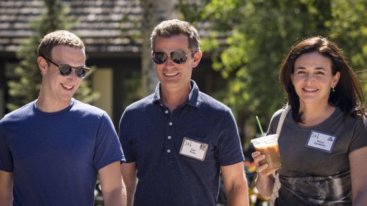 Mark Zuckerberg, chief executive officer of Facebook, Dan Rose, vice president, partnerships at Facebook, and Sheryl Sandberg, chief operating officer of Facebook, attend the annual Allen & Company Sun Valley Conference, July 12, 2018 in Sun Valley, Idaho. Every July, some of the world's most wealthy and powerful businesspeople from the media, finance, technology and political spheres converge at the Sun Valley Resort for the exclusive weeklong conference. (Photo by Drew Angerer/Getty Images)
