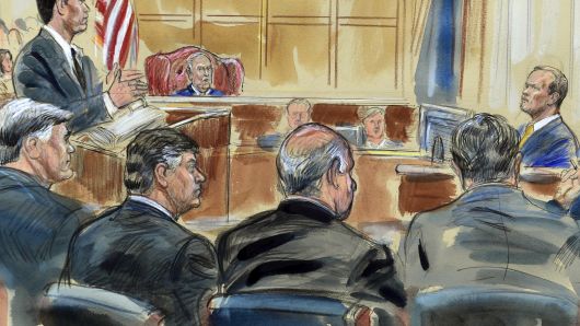 This courtroom sketch depicts Rick Gates, right, answering questions by prosecutor Greg Andres as he testifies in the trial of Paul Manafort, seated second from left, at the Alexandria Federal Courthouse in Alexandria, Va., Monday, Aug. 6, 2018. 