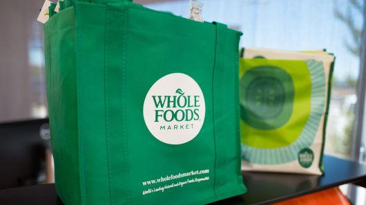 Reusable shopping bag with logo at Whole Foods Market grocery store in Dublin, California. 