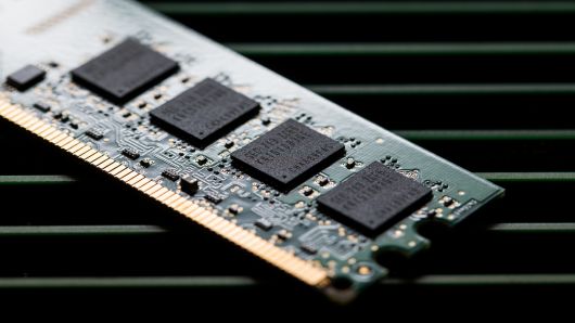 Memory chips are seen on a Samsung Electronics memory module in this arranged photograph in Seoul, South Korea, on Thursday, July 26, 2018. 