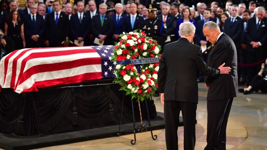 United States Senators Chuck Schumer and Mitch McConnell stand near the casket of late Senator John McCain in the Capitol Rotunda as he lies in state at the U.S. Capitol, in Washington, DC on Friday, August 31, 2018. 