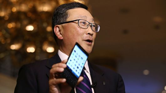John Chen, chief executive officer of BlackBerry Ltd., holds the BlackBerry Priv smartphone.