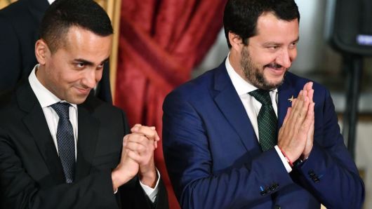 Italy's Interior Minister and deputy PM Matteo Salvini (R) and Italy's Labor and Industry Minister and deputy PM Luigi Di Maio gesture during the swearing in ceremony of the new government led by Prime Minister Giuseppe Conte at Quirinale Palace in Rome on June 1, 2018.
