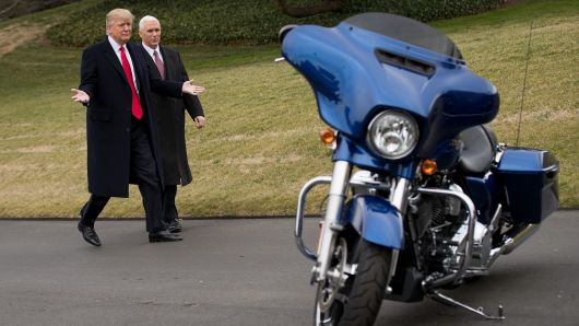 President Donald Trump and Vice President Mike Pence walk together on their way to greet Harley Davidson executives on the South Lawn of the White House, February 2, 2017 in Washington, DC.  
