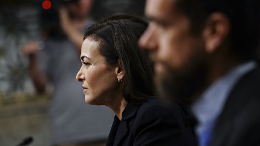 Sheryl Sandberg, chief operating officer of Facebook Inc., left, listens during a Senate Intelligence Committee hearing in Washington, D.C., U.S., on Wednesday, Sept. 5, 2018.