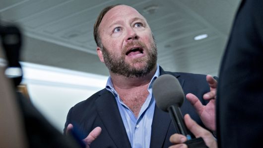 Alex Jones of Infowars, conducts a news conference outside a Senate (Select) Intelligence Committee hearing in Dirksen Building where Sheryl Sandberg, Facebook COO, and Jack Dorsey, Twitter CEO, were testifying on the influence of foreign operations on social media on September 5, 2018. 