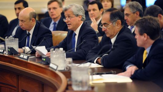 (L-R) Lloyd Blankfein, CEO of Goldman Sachs Group, Inc.; James Dimon, CEO of JPMorgan Chase & Company; John Mack, chairman of the Board of Morgan Stanley; and Brian Moynihan, CEO president of the Bank of America Corporation testify during the first public hearing of the Financial Crisis Inquiry Commission hearing on January 13, 2010 on Capitol Hill in Washington, DC. The Financial Crisis Inquiry Commission (FCIC) is a ten-member commission appointed with goal of investigating the causes of the financial crisis of 2007�2009. 