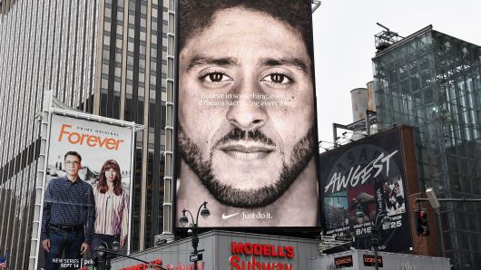 A Nike Ad featuring American football quarterback  Colin Kaepernick is on diplay September 8, 2018 in New York City. - Nike's new ad campaign featuring Kaepernick, the American football player turned activist against police violence, takes a strong stance on a divisive issue which could score points with millennials but risks alienating conservative customers. 