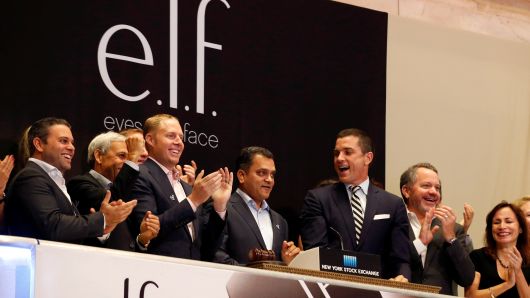 Tarang Amin (C), Chairman and CEO of cosmetics company e.l.f. Beauty Inc., rings the opening bell at the New York Stock Exchange (NYSE) to celebrate his company's IPO in New York City, U.S. September 22, 2016. 