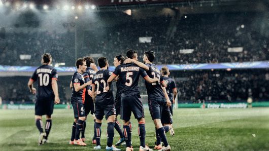 Marquinhos of Paris Saint-Germain #5 celebrates with team mates as he scores their first goal during the UEFA Champions League Round of 16 second leg match between Paris Saint-Germain FC and Bayer Leverkusen at Parc des Princes on March 12, 2014 