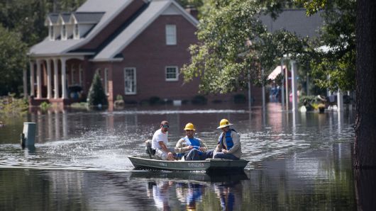 People navigate floodwaters caused by Hurricane Florence near the Waccamaw River on September 23, 2018 in Conway, South Carolina. 