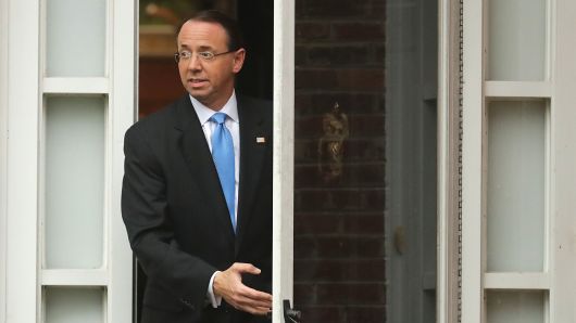 Deputy Attorney General Rod Rosenstein leaves his home on September 25, 2018 in Bethesda, Maryland. Presuming his time at the Justice Department was in jeopardy, Rosenstein met Monday with White House Chief of Staff John Kelly but was told to stay on the job at least until Thursday when they will meet with President Donald Trump. 