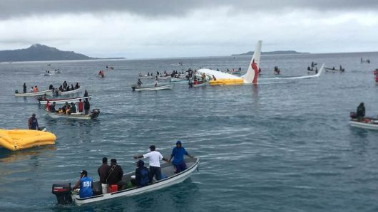 People are evacuated from an Air Niugini plane crashed in the waters in Weno, Chuuk, Micronesia, September 28, 2018 in this picture obtained from social media. 