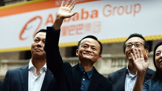 Chinese online retail giant Alibaba CEO Jack Ma (C) waves as he arrives at the New York Stock Exchange in New York on September 19, 2014.