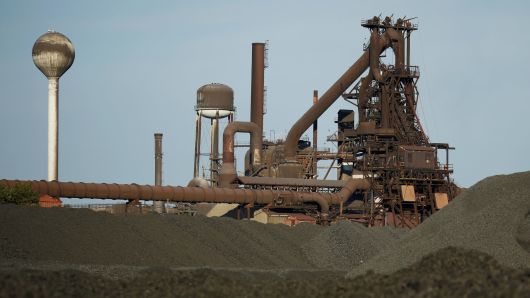 Mounds of coking coal sit piled near the blast furnace at the AK Steel mill in Middletown, Ohio.
