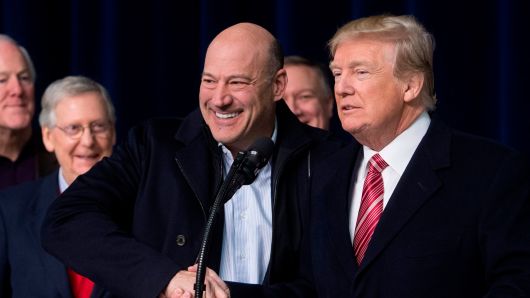 President Donald Trump shakes hands with Gary Cohn, Director of the National Economic Council, during a retreat with Republican lawmakers and members of his Cabinet at Camp David in Thurmont, Maryland, January 6, 2018.