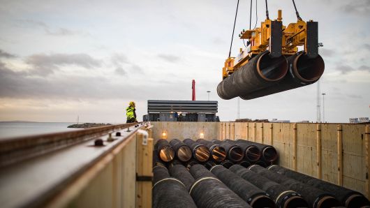 Nord Stream 2 pipes are loaded onto a vessel in the northern German port of Mukran for transshipment to a storage yard.