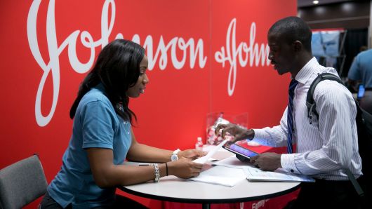 A job seeker talks to a Johnson & Johnson job recruiter at a career fair in Washington, D.C.