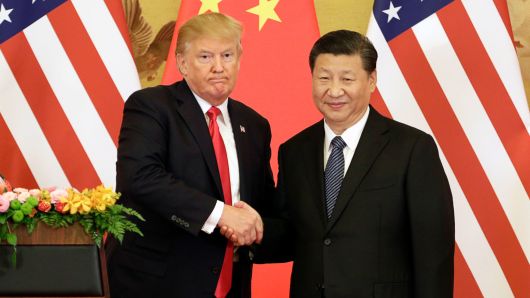 U.S. President Donald Trump, left, and Xi Jinping, China's president, shake hands during a news conference at the Great Hall of the People in Beijing, China, on Thursday, Nov. 9, 2017.
