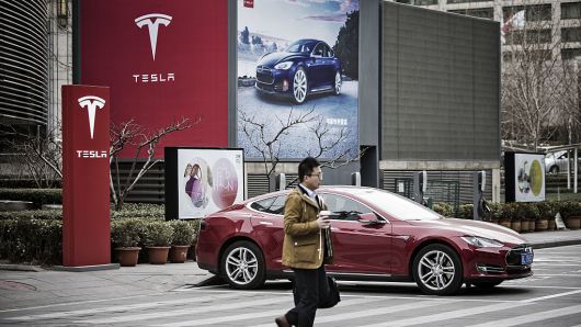 A Tesla Motors Model S electric automobile at one of the company's electric charging stations in Beijing on March 9, 2016.