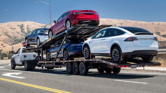 Tesla vehicles are transported on a truck after leaving the company's manufacturing facility in Fremont, California, on Wednesday, June 20, 2018. 