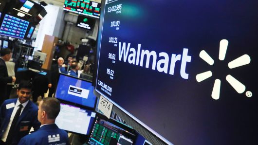 A Walmart logo is displayed above the floor of the New York Stock Exchange shortly after the opening bell in New York, August 16, 2018. 