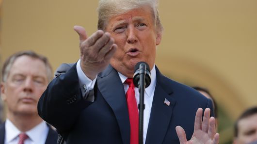 President Donald Trump gestures while taking questions during a press conference to discuss a revised U.S. trade agreement with Mexico and Canada in the Rose Garden of the White House on October 1, 2018 in Washington, DC. 