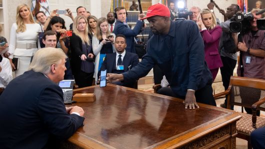 President Donald Trump meets with rapper Kanye West (R) in the Oval Office of the White House in Washington, DC, on October 11, 2018. 
