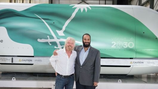 Crown Prince of Saudi Arabia Mohammed bin Salman Al Saud (R)  poses with Richard Branson (L), founder of Virgin Group Ltd. during his visit to Virgin Galactic company as part of his official visits in California, United States on April 2, 2018. 