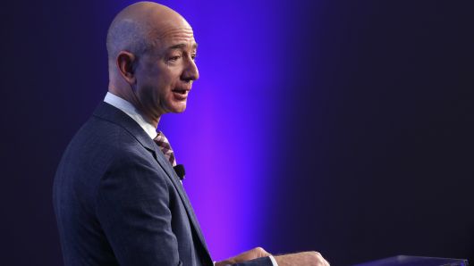 Amazon founder and Washington Post owner Jeff Bezos speaks during the opening ceremony of the media company's new location.