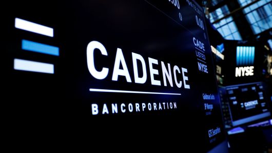 A logo and ticker info for Cadence Bancorp, LLC is displayed on a screen during the company's IPO, on the floor of the New York Stock Exchange (NYSE) in New York, U.S., April 13, 2017.
