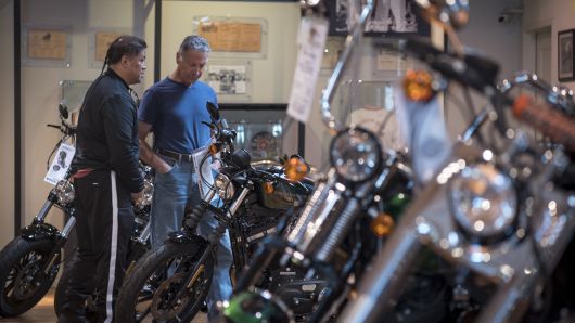 Customers view Harley-Davidson Inc. motorcycles at the company's dealership in South San Francisco, California, U.S., on Tuesday, June 26, 2018. 