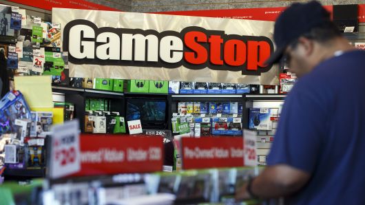 Signage is displayed as a customer browses at a GameStop Corp. store in West Hollywood, California.