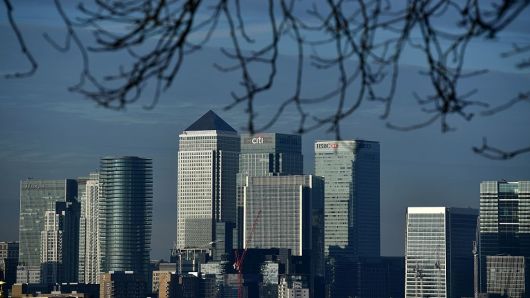 The financial offices of banks, including JPMorgan Chase, Citi, HSBC, and other institutions in the financial district of Canary Wharf, are pictured from Greenwich Park in London on January 17, 2017.