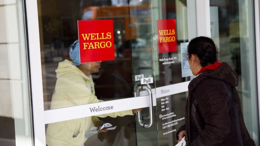 A customer exits a Wells Fargo & Co. bank branch in Los Angeles Patrick T. Fallon/Bloomberg via Getty Images