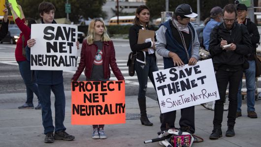 Supporters of net neutrality protest outside a Federal Building in Los Angeles, California on November 28, 2017. 