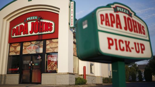 Signage is displayed outside a Papa John's International pizza restaurant in Louisville, Kentucky.