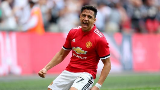 Alexis Sanchez of Manchester United celebrates after scoring his sides first goal during The Emirates FA Cup Semi Final match between Manchester United and Tottenham Hotspur at Wembley Stadium on April 21, 2018 in London, England. 
