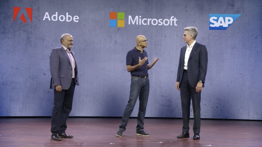 Adobe CEO Shantanu Narayen, Microsoft CEO Satya Nadella and SAP CEO Bill McDermott announce the Open Data Initiative at Microsoft's 2018 Ignite conference in Orlando, Florida.