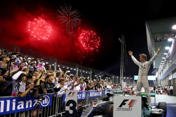 Nico Rosberg of Germany and Mercedes GP celebrates his win in parc ferme during the Formula One Grand Prix of Singapore at Marina Bay Street Circuit on September 18, 2016 in Singapore. 